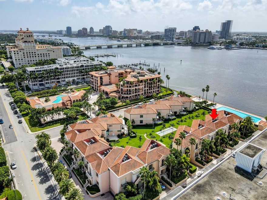 What a great time to own a little piece of Palm Beach Island!  Call today for a private showing of this amazing dream home.  This wonderful townhome is located in Villa Plati just a few feet from the Intracoastal Waterway with spectacular SW views of Flagler Bridge, West Palm Beach skyline, and some of the world's most elegant yachts!  This townhome has a private garage large enough for up to 6 vehicles.  This prime location is about a 5 minute walk to restaurants, Publix and some of the best shopping the island has to offer.  If shopping or dining is not enough, then you are steps away from the pool and the Palm Beach Lake Trail where you can take a leisurely walk, bike ride, jog, or even roller blade.  This 3 bedroom townhome features an oversized patio overlooking the Intracoastal Waterway.  The main level features marble floors with an enormous family room, dining room, and stairwell; oversized kitchen with high end appliances, natural gas cooktop, oven, and marble countertops; office/den; powder room; high ceilings throughout; and elevator.  The upper level features 2 sizable guest bedrooms with private baths; and a large master bedroom and bath with 2 sizable walk in closets, and a private balcony overlooking the Intracoastal!  This home is ready for you to make it your own!