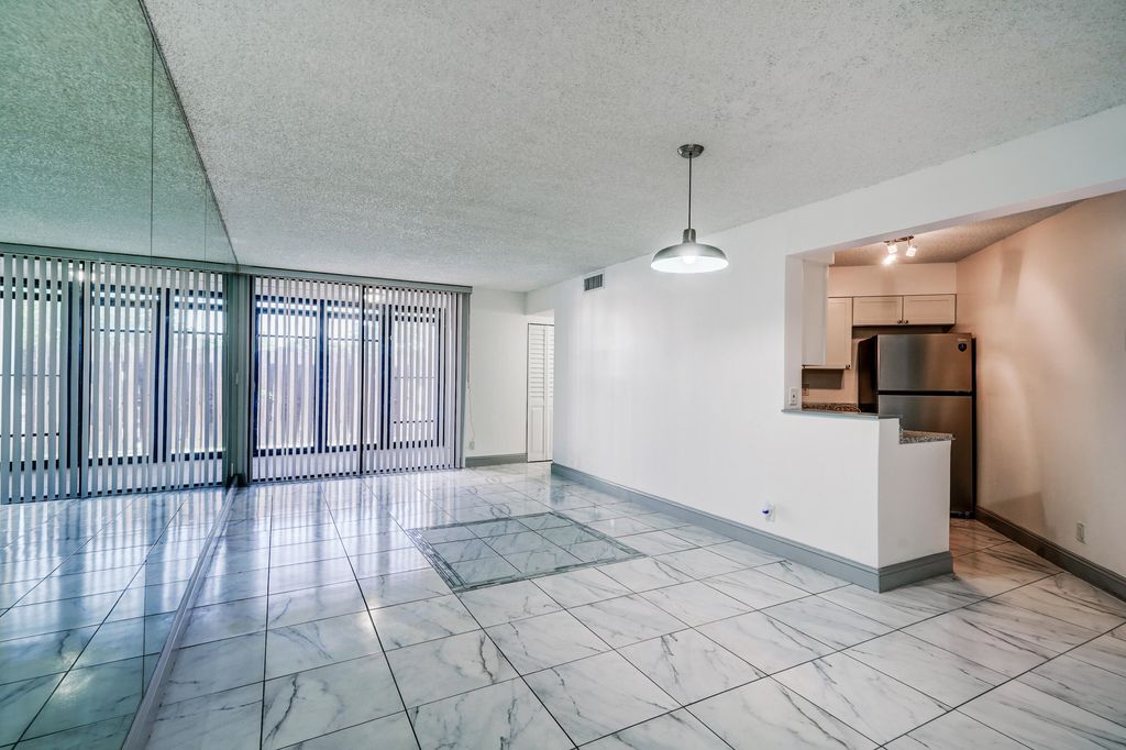 Photo of 212 Lake Pointe Drive #102, Oakland Park, FL 33309 (MLS # B26022051)