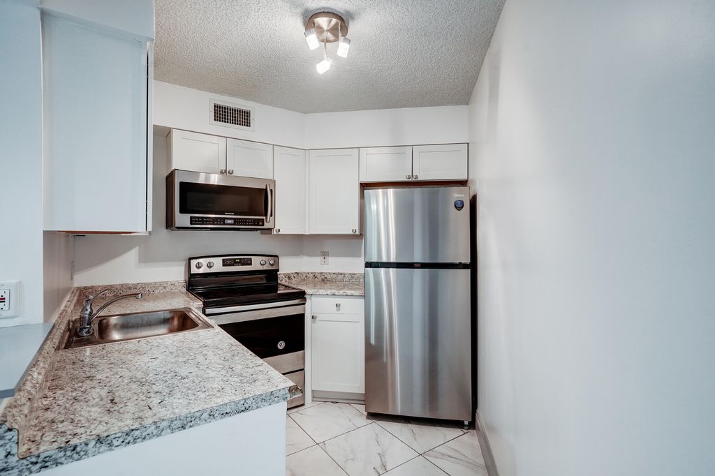 Photo of 212 Lake Pointe Drive #102, Oakland Park, FL 33309 (MLS # B26022051)