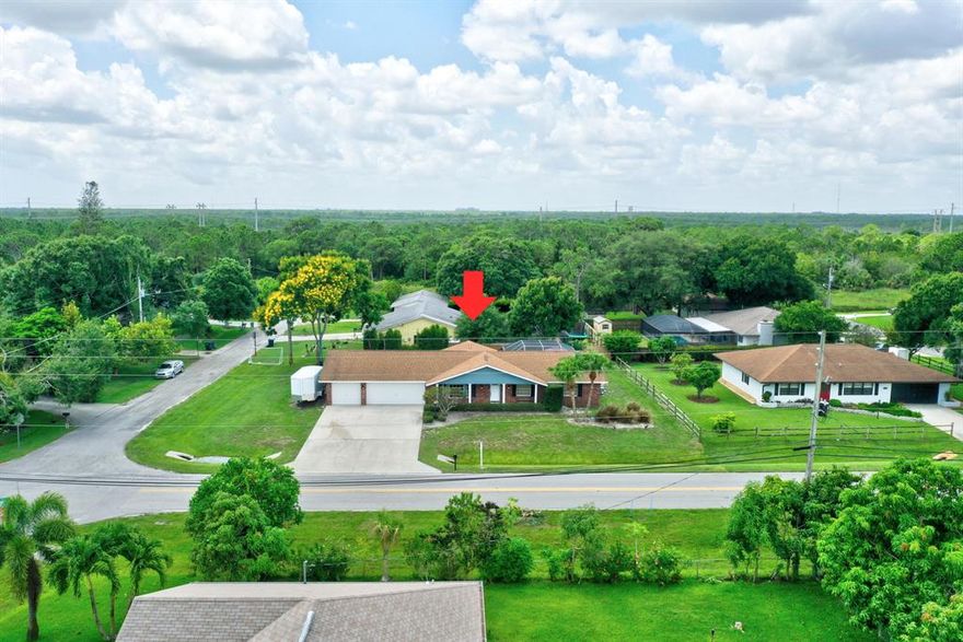 PRIVACY NEXT TO SAVANA STATE PRESERVE on this 1/3 Acre corner lot home. Updates and improvements include fresh paint, a large kitchen, wine cooler, newer appliances, walk in pantry. Great out-door space with a screened and covered patio featuring a fabulous in-ground solar heated pool with fantasy multicolor led-lighting. Huge laundry room with washer/dryer & sink. OVERSIDED 3 CAR GARAGE w/auto door openers and additional workspace. This property offers plenty of room for all your toys, boats, RVs and pets. Just minutes from Savana State Park entrance for hiking, pet walking, and beautiful habitat in the preserve. Just a few more minutes to the Indian River!