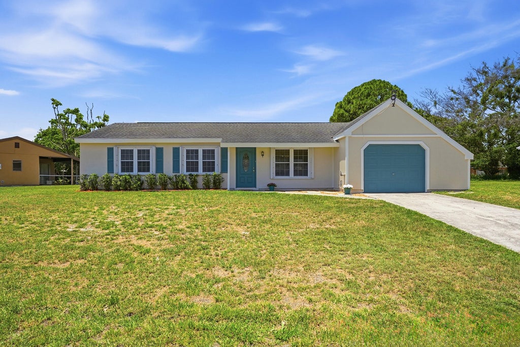 Photo of 450 SW Kentwood Road, Port Saint Lucie, FL 34953 (MLS # B26032908)