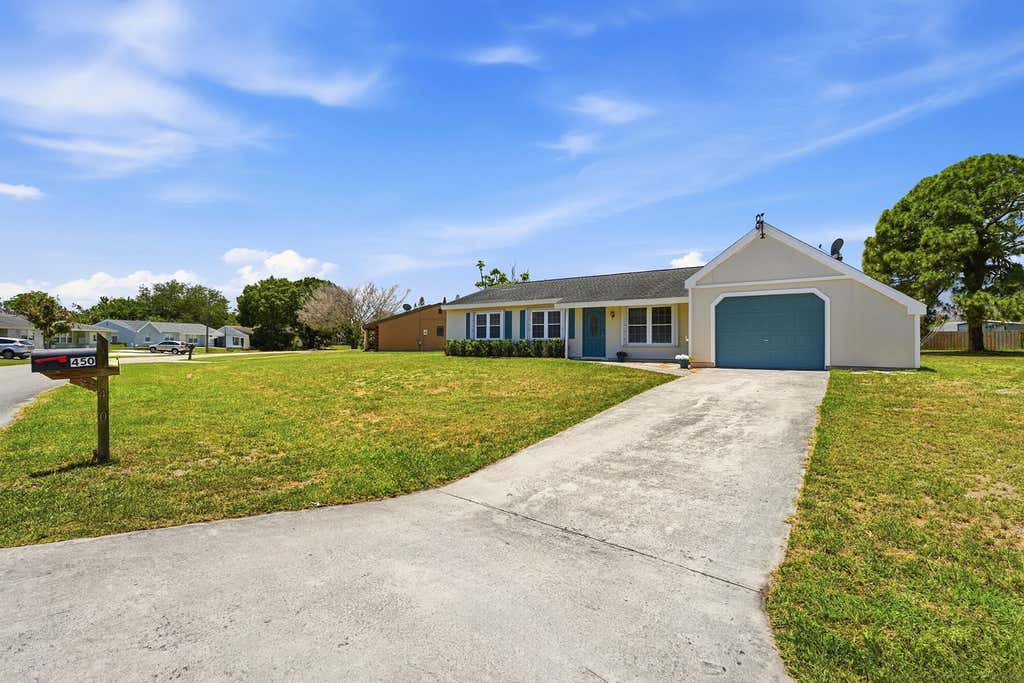 Photo of 450 SW Kentwood Road, Port Saint Lucie, FL 34953 (MLS # B26032908)