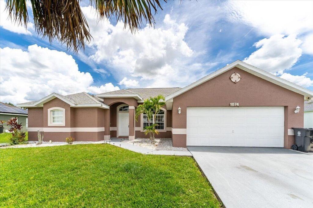 Photo of 1074 SW Whittier Terrace, Port St Lucie, FL 34953 (MLS # R10912344)