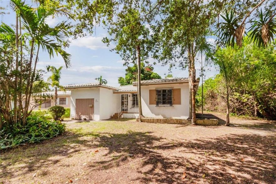 Amazing house in Biscayne Park with huge potential. Could easily be converted to add bedrooms and bathrooms. Huge vaulted ceilings waiting to be exposed. Giant backyard. Garage with a huge ceiling could be converted. Don't miss this rare opportunity! Strictly sold As Is.