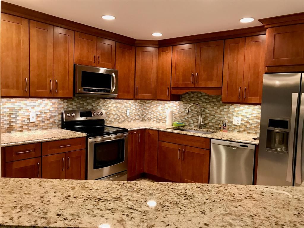 Photo of 13 Lexington Lane Ln E #F, Palm Beach Gardens, FL 33418 (MLS # R10775114)