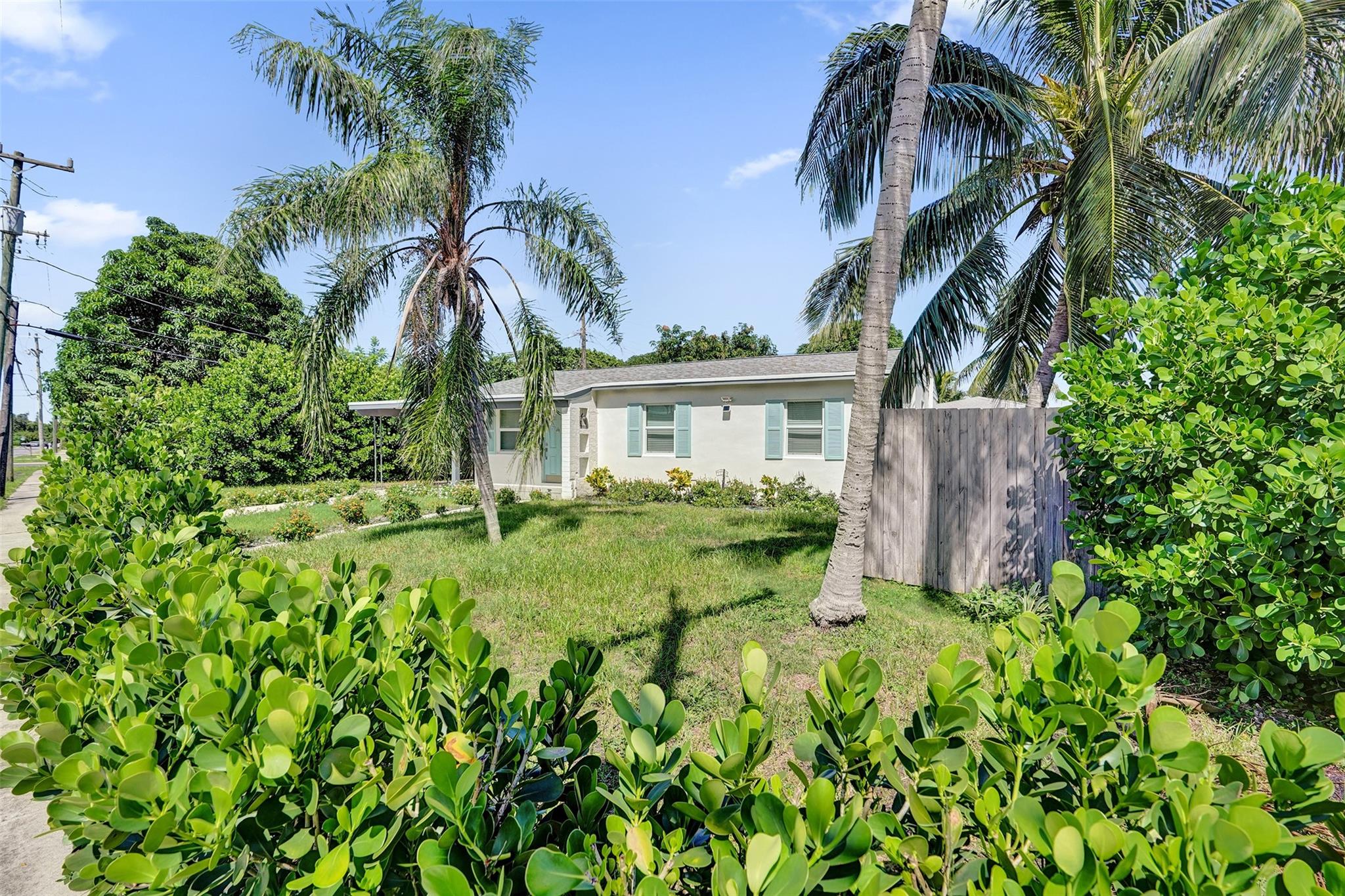 Welcome to this charming Lake Worth Beach home on corner lot! No HOA! This beautifully updated 3-bedroom home offers a flexible layout with 1,322 sq. ft. of stylish living space! Renovated in 2019 - roof, AC, impact windows, electrical & water heater! New flooring, paint and landscape in 2024. Open Kitchen with stainless appliances! Easy to add a second bathroom! Enjoy your back yard living area with fruit trees. Space for a pool, guest house, RV, boat and much more! Western exposure. Negotiable furnishings. Whether you’re looking for a full-time residence, vacation home, or rental investment, you’ll love being just minutes from white sand beaches, Lake Osborne, marinas, vibrant dining, and exciting future developments like the Horizon plan with a Nicklaus golf course and new hotels!