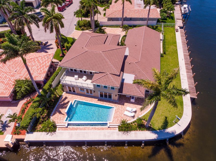 One-of-a-kind protected point lot home with 229ft deep water(New 100ft dock and seawall)on the turning basin +ICW-accommodates any boat.Everything is brand new! Smart home,All new plumbing, electric,IMPACT glass throughout,8-10 car driveway+2CG,new irrigation system and landscaping,fenced,Infinity edge pool. Grand entryway door that invites you in to a gorgeous,classy & bright home with high ceilings, marble floors,floor to ceiling stone fireplace wall.Mater suite overlooks ICW with huge terrace.