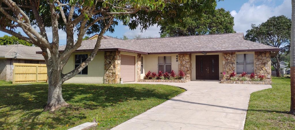 Photo of 449 NW Marion Avenue, Port Saint Lucie, FL 34983 (MLS # R11079951)