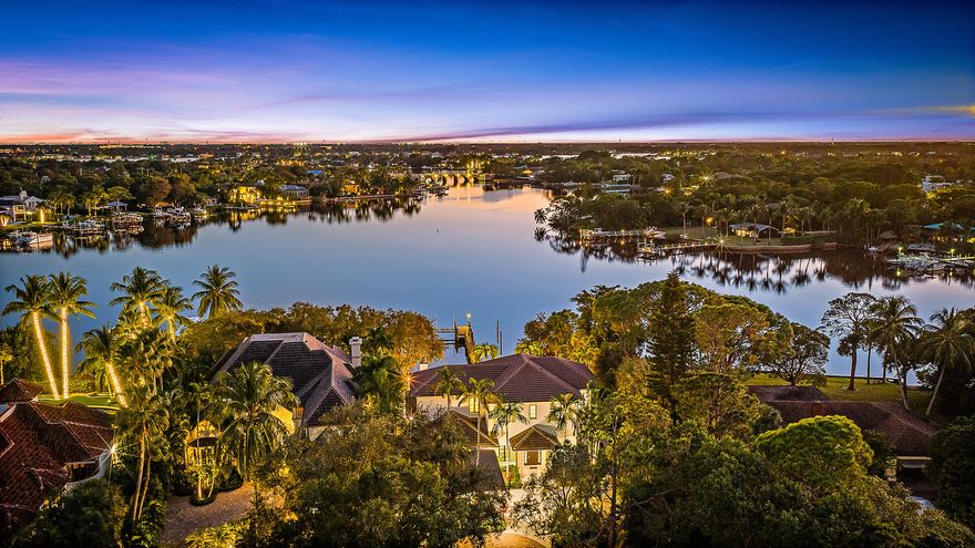 Nestled on nearly one acre of pristine riverfront, this exceptional estate offers breathtaking wide-water views facing south. The main residence features 4 spacious bedrooms, designed to capture natural light and the serene beauty of the river. A charming two-story guest house provides ultimate flexibility, with 2 separate living areas each with a private bedroom,  and a full bath—perfect for extended family, visitors, or a private studio. Outdoor living is elevated with a stunning loggia, complete with a fireplace and elegant stone floors, creating the ideal setting for entertaining or quiet evenings overlooking the majestic river. This rare offering combines timeless architecture with unmatched views, delivering a lifestyle of tranquility and sophistication along the water's edge.