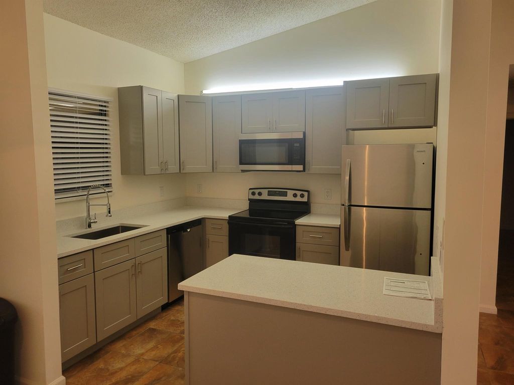 Photo of 66 Via De Casas Norte, Boynton Beach, FL 33426 (MLS # R11014972)