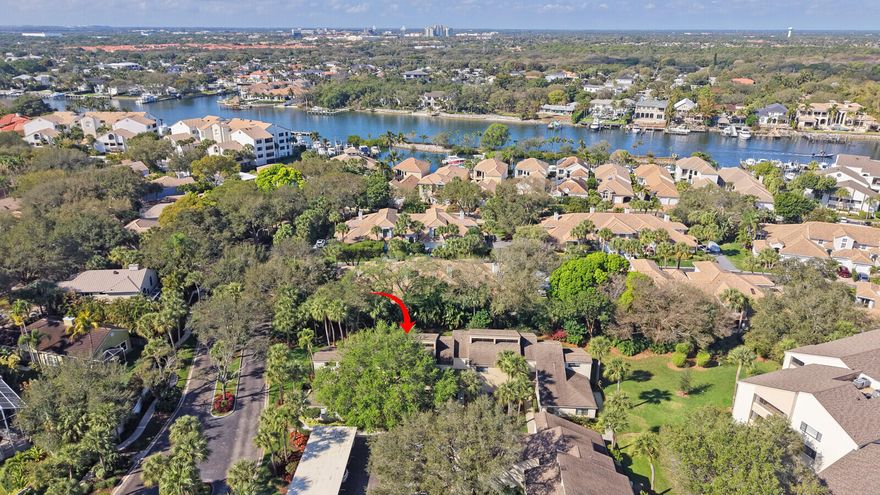 Discover effortless coastal living in this beautifully maintained 2-bedroom, 2.5-bath townhouse nestled within the gated waterfront community of Oak Harbour in Juno Beach. Designed for comfort and privacy, both upstairs bedrooms are spacious suites, including a serene primary retreat with its own private balcony and generous attic storage. The open living and dining areas create a warm, inviting space to relax or entertain, while the screened patio overlooks lush, mature landscaping for peaceful indoor-outdoor living. Move-in ready with granite kitchen countertops and timeless finishes, this home offers access to resort-style amenities, marina slips, pools, fitness center, tennis and pickleball--all just minutes from the beach, dining, and shopping.