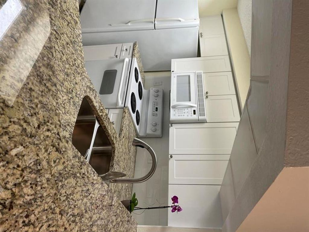 Photo of 3020 Alcazar Place Pl #201, Palm Beach Gardens, FL 33410 (MLS # R10763119)