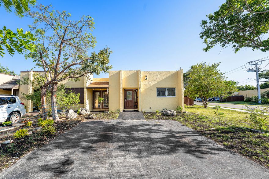Welcome to a beautifully upgraded residence at 250 NW 43rd Place in Deerfield Beach, where modern comfort meets effortless South Florida living. This thoughtfully enhanced home showcases a bright, open-concept layout accented by newly installed recessed lighting (2025) and designer ceiling fans (2025), creating a warm yet sophisticated ambiance throughout the main living and dining areas. At the heart of the home, the kitchen is tastefully refreshed with a contemporary backsplash (2024), offering both style and functionality for everyday living and entertaining. Comfort is paramount, with a high-efficiency 3.5-ton central A/C system with heating (installed 2023) and updated electrical components providing peace of mind.  Step outside into your private backyard retreat, fully enclosed by a newly installed privacy fence (2024). The outdoor living space is elevated with elegant shade sails (2024), creating a resort-inspired setting perfect for relaxing or hosting gatherings. Lush greenery and a curated selection of herbs and fruit-bearing plants, including papaya, aloe, basil, oregano, cilantro, peppermint, and pigeon peas, add a unique garden-to-table lifestyle element.  Ideally situated, this home offers unparalleled convenience with close proximity to premier shopping, dining, and entertainment. Enjoy being just minutes from Publix, Walmart, and Pompano City Centre, while the pristine shores of Deerfield Beach and its iconic International Fishing Pier are only a short drive away. Easy access to I-95, Florida's Turnpike, and Fort Lauderdale-Hollywood International Airport ensures seamless connectivity.  This is a rare opportunity to own a move-in-ready home that blends modern upgrades, outdoor serenity, and an exceptional location.