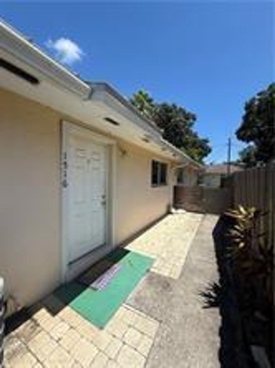 Spacious and Well-Maintained 2/2 Duplex - Central Vero Beach featuring impact windows, washer/dryer hookups, and private fenced patios and yards. Located in central Vero Beach, just minutes from shopping, schools, and all local amenities.