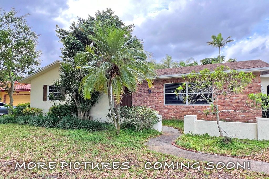 Photo of 661 Palmetto Drive, Coconut Creek, FL 33066 (MLS # F10541198)