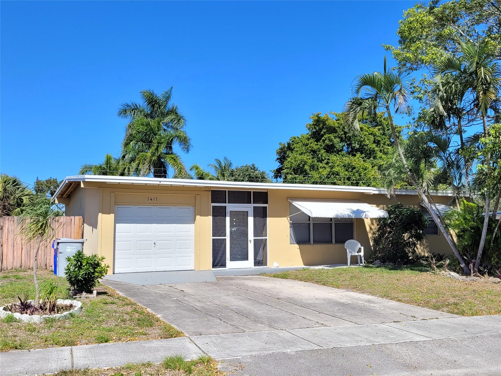 This Lovely 3Bed / 1Bath home features a one car garage, Modern Open Layout, Strong CENTRAL AC, Beautiful Renovated Kitchen, & HUGE fenced in backyard with Shaded Back Patio. - INTERIOR AMENITIES include Laundry Washer & Dryer, Stainless Steel Appliances in Kitchen, Strong CENTRAL A/C & Fully Tiled Throughout. - LOCATED conveniently near 2 Fabulous Beaches, lots of shopping & dinning, and close to Federal Hwy and I-95. two Blocks from Norcrest Elementary School. POLICIES- Tenant is responsible for utilities and lawn care.- PETS: small dogs / cats.- SMOKING is NOT permitted inside of the home.