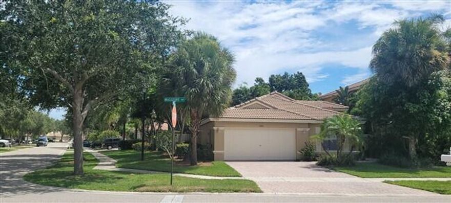 say HELLO to the Villages of West Palm Lakes, featuring the 24 hour manned gated community, the highly sought after Lakes Of Laguna, offering additional presence of 24-hour roaming security keeping safety a priority! Enjoy this Beautiful 3Bdr/2Bath/2Car Home Located in Gated Community of Lakes of Laguna. This Corner Lot Home Includes an Open & Airy Floor Plan with Contemporary Flair, Large Great Rm for Entertaining w/2 Sliders Leading to a Large Fenced yard w/Room for Pool, Newly Painted Exterior, New Doors & Hardware. Kitchen Equipped with High Ceilings, Kitchenette, Breakfast Bar, Stainless Steel Appliances, New Gorgeous Quartz Countertops, Sink & Cabinets. Also Includes Large Master Suite w/Bath & Walk-in Closet, Laundry Rm, Beautiful Flooring Throughout, Custom Lighting all on a quiet and beautifully tree lined street. This family funtastic community also offers 2 community pools, tennis courts, walking trails, basketball, 2 playgrounds, running paths, has a social events calendar that is enjoyable for all ages and is located near Bear Lakes Middle and Seminole Trails Elementary. The proximity to everything fun, is literally within minutes including but not limited to The Ballpark of the Palm Beaches home to the Houston Astros and Washington Nationals, the excitement of Rosemary Square, Downtown Clematis WPB, the outlet mall, Roger Dean Stadium, the beaches of Singer Island, all the water sports you can dream of, not to mention PBI airport for easy travel, Kravitz Center for a hefty dose of culture, museums and so much more! Sitting closely between Lake Mangonia and Grassy Waters Preserve, there are a number of avenues for a weekend escape or a sporty moment outdoors. Quick note the HOA maintains the grassy areas of the front yards - small but important perk!