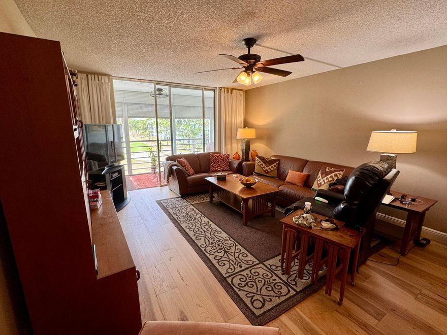 Rare 4th-top floor, corner condo with beautiful golf course views.This spacious 3-bedroom, 2-bath unit offers over 1,505 sq ft of bright, airy living space with abundant natural light and a screened patio perfect for relaxing or entertaining.The whole units has wood floors,and light color walls.the kitchen with granite counters,and SS appliances.Large primary suite featuring a walk-in closet and modern bath.Two more bedrooms one with a custom made wall unit and a Murphy bed. Very active 55+community,Pay as you play Golf course,Residents enjoy resort-style amenities, including a clubhouse, restaurant,2 pools, fitness center, and social activities. New roof 2024,accordion shutters.Maintenance fee includes water, cable, building insurance, exterior maintenance,elevator,pest control,reserves.