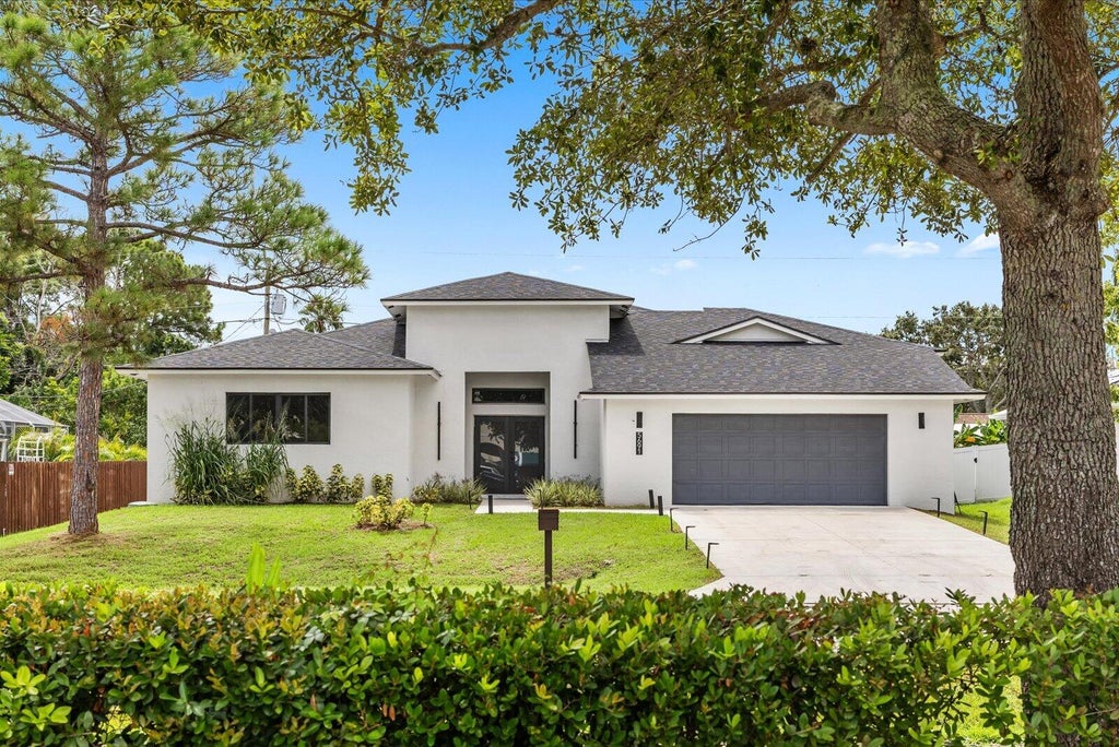 Photo of 5691 NW North Macedo Boulevard, Port Saint Lucie, FL 34983 (MLS # B26076186)