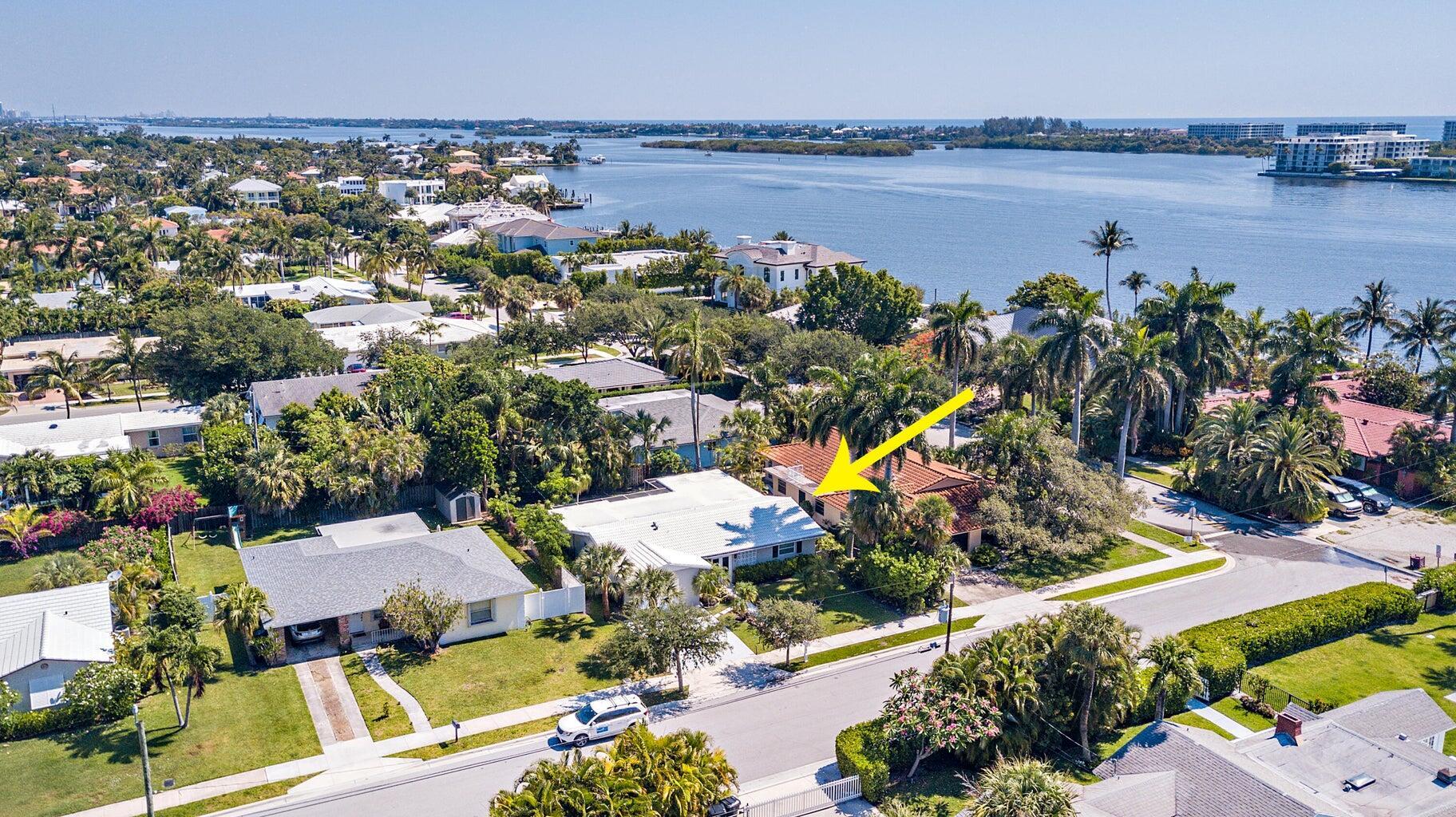 Welcome to this charming ranch-style home, perfectly situated in the heart of College Park in Lake Worth Beach. This renovated 3 bedroom, 2 bathroom residence is filled with natural light and features impact glass throughout. Enjoy serene morning walks just steps from the Intracoastal Waterway, with breathtaking sunrises and expansive water views. Step outside to a backyard oasis, complete with a hot tub, outdoor fire pit, and plenty of space for entertaining. Located just minutes from downtown Lake Worth's vibrant shops and restaurants, and a short drive from The Park golf course, this home blends comfort, style, and convenience.