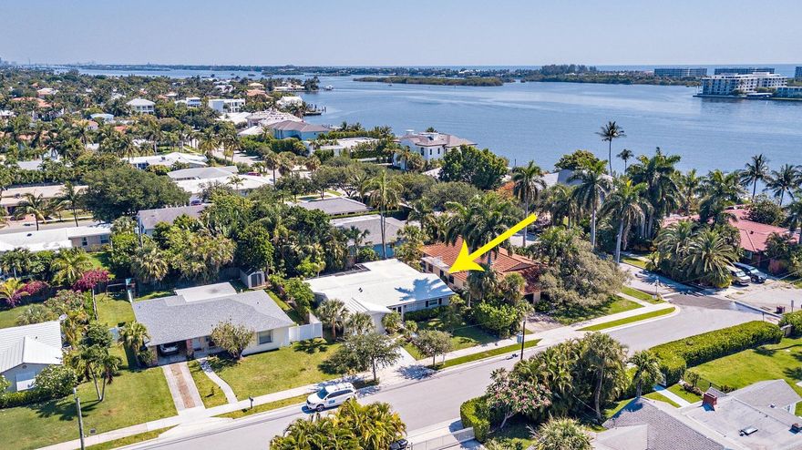 Welcome to this charming ranch-style home, perfectly situated in the heart of College Park in Lake Worth Beach. This renovated 3 bedroom, 2 bathroom residence is filled with natural light and features impact glass throughout. Enjoy serene morning walks just steps from the Intracoastal Waterway, with breathtaking sunrises and expansive water views. Step outside to a backyard oasis, complete with a hot tub, outdoor fire pit, and plenty of space for entertaining. Located just minutes from downtown Lake Worth's vibrant shops and restaurants, and a short drive from The Park golf course, this home blends comfort, style, and convenience.