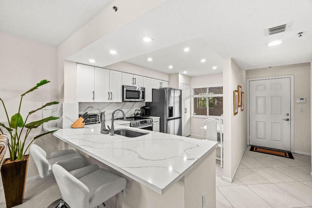 Photo of 12540 Majesty Circle #303, Boynton Beach, FL 33437 (MLS # R11157000)