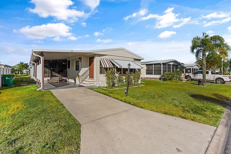 Welcome to affordable Florida living in the all-ages Barefoot Bay recreational community where you own the land and enjoy resort-style amenities with no lot rent. Located in the desirable Flower Section, this 2-bedroom, 2-bath home offers 1,294 sq ft of living space with large rooms, strong structural updates, and the opportunity to personalize the interior. 

Inside, you'll find oversized living and family room spaces with built-in shelving and large windows, creating a bright and comfortable environment for everyday living. The entertaining-style kitchen features a center island cooktop, abundant cabinetry, and open flow to the dining area, making it ideal for hosting gatherings.

The extra-large primary suite includes dual sinks, walk-in shower, and walk-in closet, while the guest bedroom offers its own en-suite bathroom for added privacy. A window-enclosed sunroom provides flexible bonus living space perfect for relaxing, hobbies, or entertaining. The property also includes a carport, storage shed, patio area, and generator plug.

Major updates include metal roof (2020), water heater (2020), partial re-pipe, vapor barrier replacement, added hurricane straps, AC with newer blower unit, and clamshell hurricane shutters on most windows. Cosmetic updates will allow the next owner to make this home their own while building equity.

Barefoot Bay is known for its active coastal lifestyle and extensive amenities, including: Three community swimming pools, 18-hole executive golf course, Clubhouse and community center, Tennis, pickleball, shuffleboard, and bocce courts, Fitness facilities and social clubs, Fishing pier on the Indian River Lagoon, Private ocean beach access for residents, Golf-cart-friendly streets, On-site shopping, dining, and services.
One Time BBRD fee of $1605.01 and annual tax assessment included at $1001.17. 

Conveniently located near Sebastian, Palm Bay, US-1, I-95, the Indian River Lagoon, and Atlantic beaches, Barefoot Bay remains one of the best values on Florida's east coast for full-time residents, seasonal owners, or investors. This home is priced to sell and ready for its next chapter.