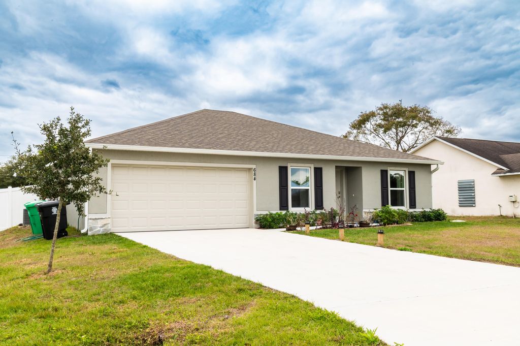 Photo of 684 SE Crescent Avenue, Port Saint Lucie, FL 34984 (MLS # R11158053)