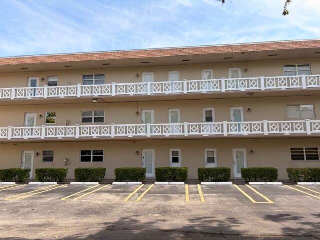 Photo of 5103 NW 35th Street #401, Lauderdale Lakes, FL 33319 (MLS # B26028388)