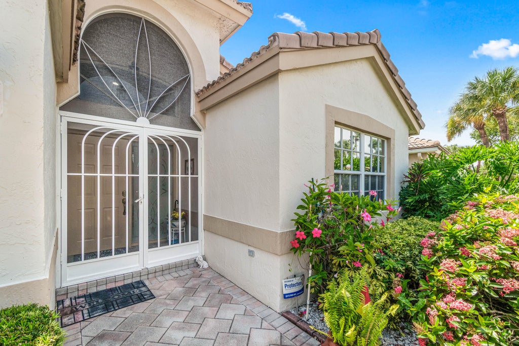 Photo of 12185 CASTLE PINES Road, Boynton Beach, FL 33437 (MLS # B26055351)
