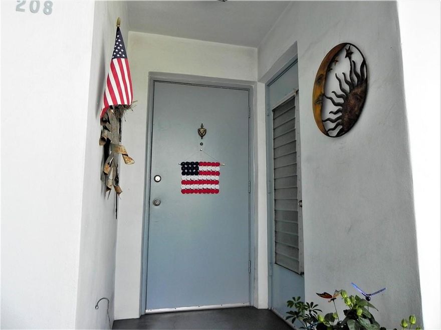 All ages welcome! Nice 2/2 with carpet throughout. OK to lease after two years ownership. New Bosch A/C installed in 2019 and water heater installed in 2013. Impact windows throughout and accordion storm shutters on balcony. Garden views from screened balcony. Updated primary bathroom has tub/shower combo. Hall bathroom needs complete rehab. Lots of storage; full height closets in both bedrooms plus extra storage unit nearby. Unit is located steps from elevator & laundry room, assigned parking space #49 is steps from the building. Amenities include community room, pool, library. Conveniently located near shopping, highways, FLL airport, world famous Hard Rock Guitar Hotel & Casino, downtown nightlife and beautiful Hollywood beaches.  25% down. Cats and birds only. No dogs. See show assist.