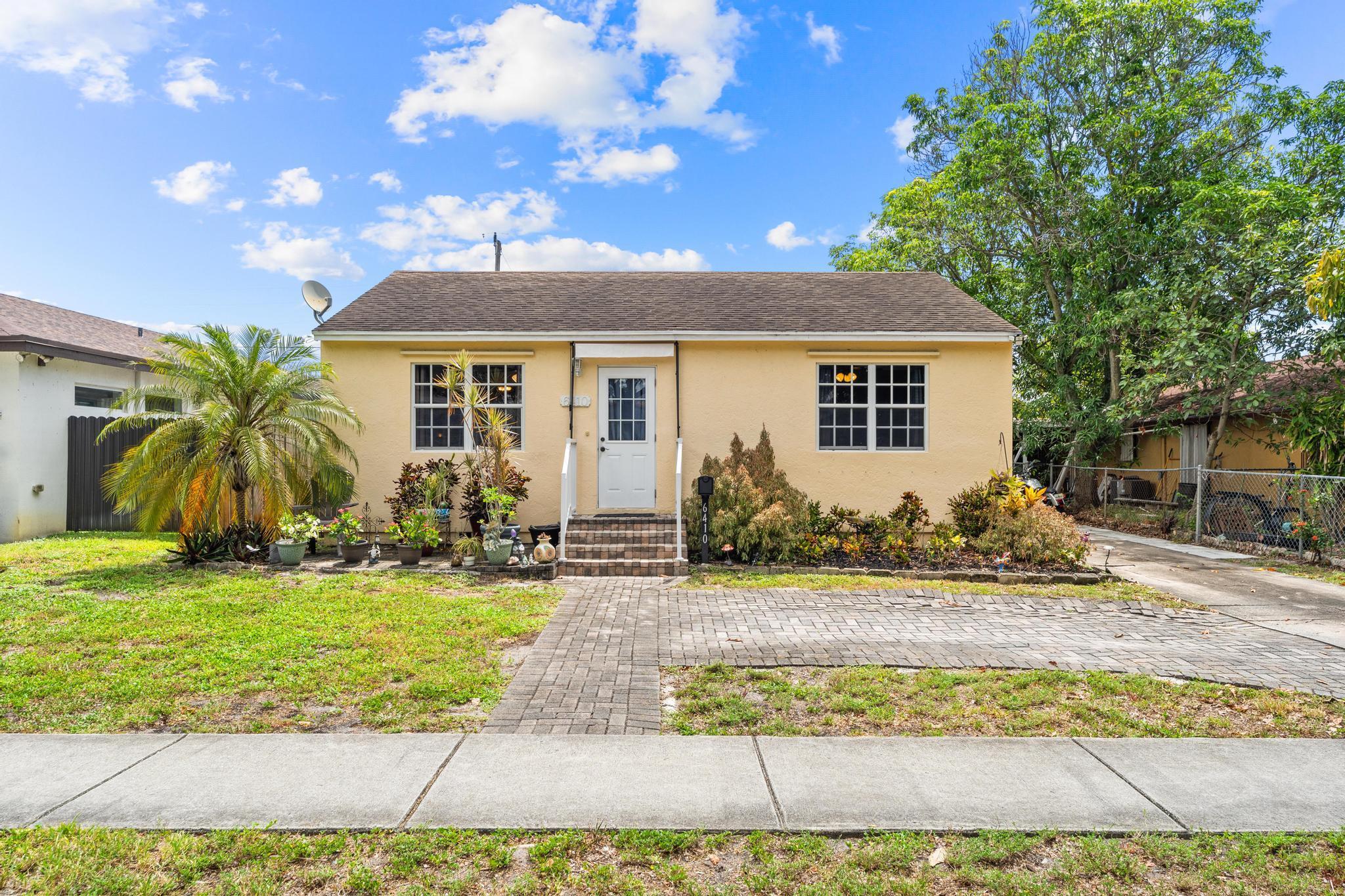 This 3-bedroom, 2-bath property offers flexibility for homeowners or investors. Inside, wood and tile floors run throughout, complemented by natural light and a spacious primary suite with a walk-in closet. The primary bathroom features double sinks and a walk-in shower. Enjoy the backyard deck for relaxing or entertaining, plus a handy storage shed. The home also features a 2021 AC and panel shutters for added peace of mind. Whether you're looking to move in or expand your portfolio, this property offers solid value and potential.