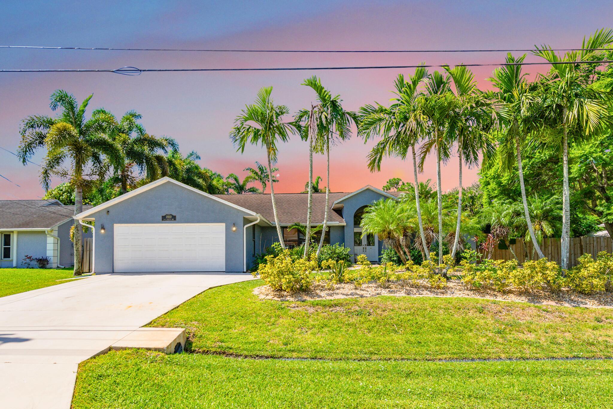 NO HOA! DOUBLE LOT! DETACHED GARAGE! POOL! IN-LAW SUITE! Experience Florida living at its finest in this private, fully fenced pool home with stunning curb appeal. The highlight: a huge open-concept kitchen featuring a 6x10 island made for entertaining. Step outside to your own oasis: a screened heated saltwater pool w/ a huge travertine patio & deck. The detached garage is a true bonus, half being climate-controlled and ready to serve as a home office, gym, or anything else. Inside, enjoy the flexibility of a private-entry in-law suite, and split floor plan. Additional features are a pavilion with power, 20x10 powered shed, city water&sewer, a private well for sprinklers, updated appliances, and pre-inspected w/ transferable Home Shield warranty. Near Crosstown Parkway, 95 and Tradition.