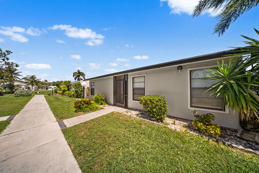 This spacious one-story villa is ideally located in the heart of West Palm Beach, just minutes from schools, shopping, and the Ballpark of the Palm Beaches, and within walking distance to the community clubhouse featuring a pool, tennis courts, and playground. The home offers great indoor-outdoor living with a large private screened patio off the living room and kitchen, plus a separate open patio off the primary suite. Bright and inviting throughout, it also includes a 2019 A/C, 2021 water heater, and a spacious laundry room with cabinet storage.  The kitchen and bathrooms are original, offering a great opportunity to personalize. Tile flooring runs throughout most of the home, with carpet in the living room and second bedroom.