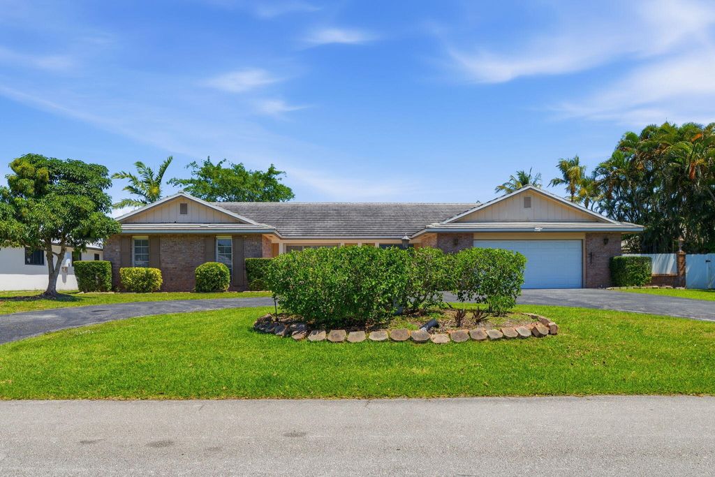 Photo of 232 Gleneagles Drive, Lake Worth, FL 33462 (MLS # B26022782)