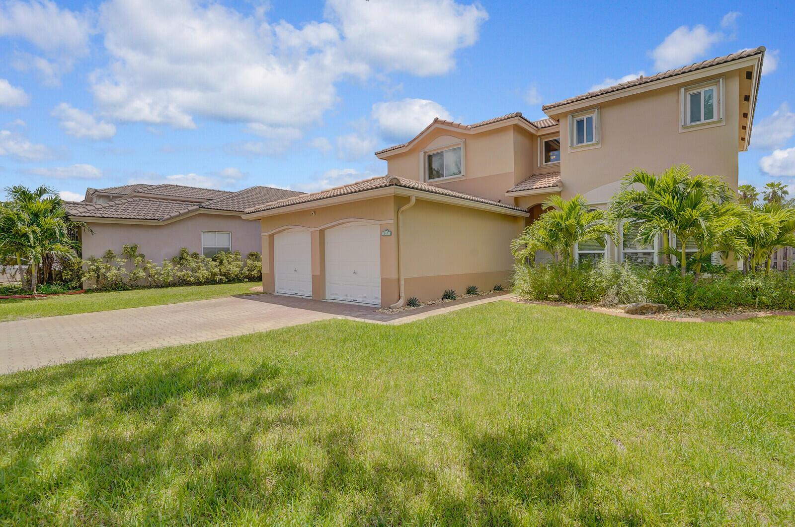 Welcome to this beautifully maintained 2-story single-family home located in a desirable 24/7 guard-gated community in Davie. This spacious residence offers 4 bedrooms, 3 full bathrooms, a 2-car garage, impact windows and doors for added security and energy efficiency, and a sparkling saltwater pool. The first floor features beautiful laminate flooring throughout, a full bedroom and bath, perfect for guests or a home office plus a formal living and dining area, and an upgraded kitchen with granite countertops, a breakfast nook and family room.