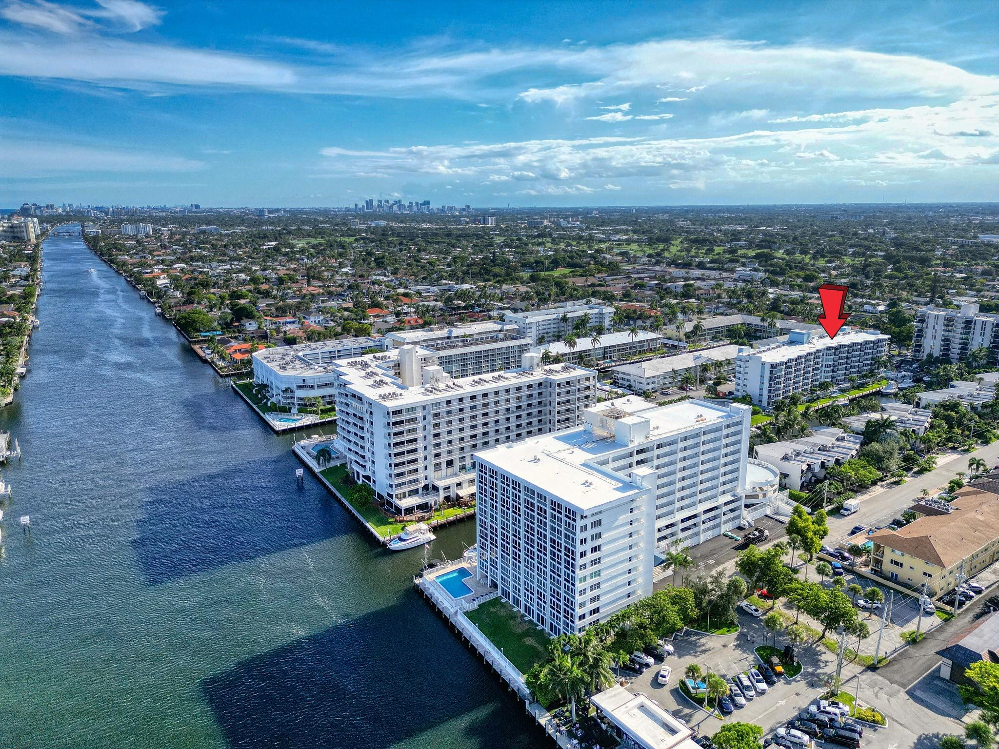 Stunning and fully updated 2/2 corner unit in a secured building along the Intracoastal Waterway, located just outside the prestigious Coral Ridge Country Club and only two blocks from the beach. This bright and modern residence features a full-size washer and dryer in-unit, all impact windows, and a spacious open layout with sleek designer finishes and exceptional natural light throughout. Covered parking is included, with space to store bikes, umbrellas, or personal items. A community boat dock is located directly downstairs as part of the building, perfect for water access, guest pickup, or drop-off by boat. Rent includes water, internet, and cable TV. A rare opportunity to live in one of Fort Lauderdale’s most desirable east-side neighborhoods! Available and easy to show.