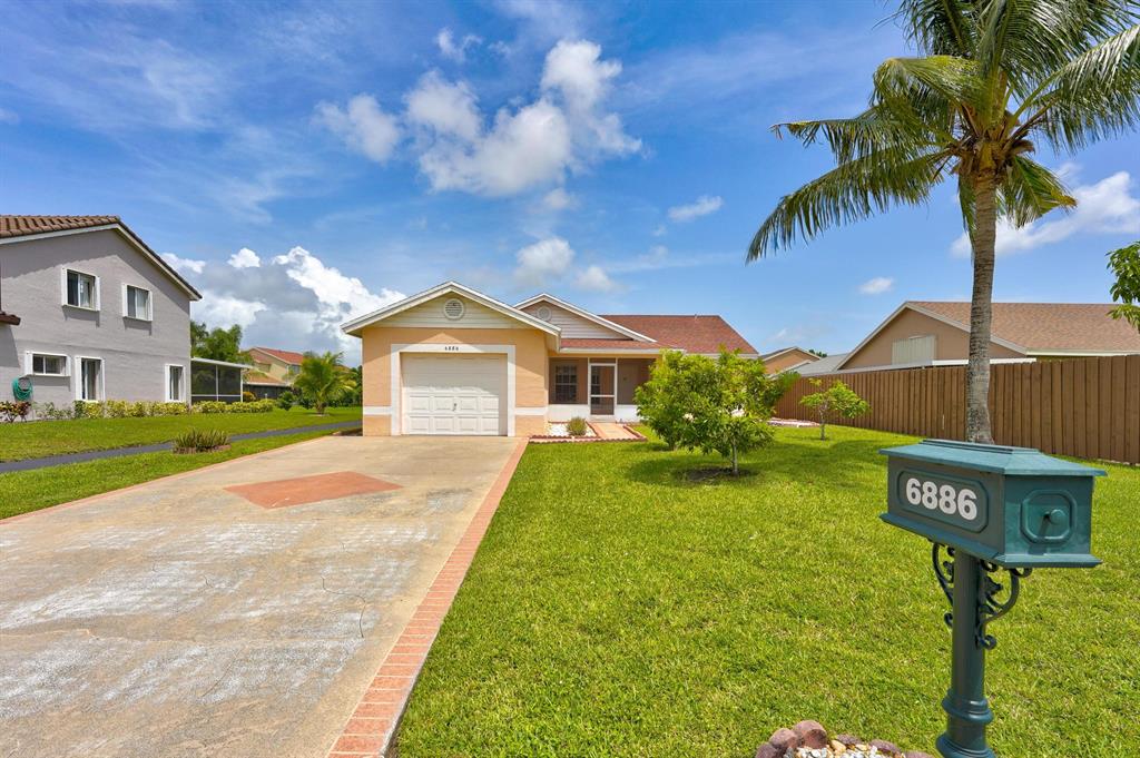 This beautiful 3 bedroom/ 2 bath home is located in one of Boynton's most coveted Neighborhoods, which boosts one of the lowest HOA's in Boynton. The home is ideally located with easy access to the Florida's Turnpike, and the I-95. The Community offers a Heated Pool, Tennis Court, and a Basketball Court. In addition, to a fabulous Walk/ Jog Path throughout the Community. The neighborhood boosts some of the best Schools; as well as, the finest Shopping, Restaurants, and Eateries. The home is literally just a walk away to the Groceries, Post Office, Library, Gym, and several Places of Worship; just to name a few. This house features, beautiful Pergo Laminate Floors throughout. There's a large Eat-in Kitchen, with two newly renovated Bathrooms. As well as, a cozy front and, huge
