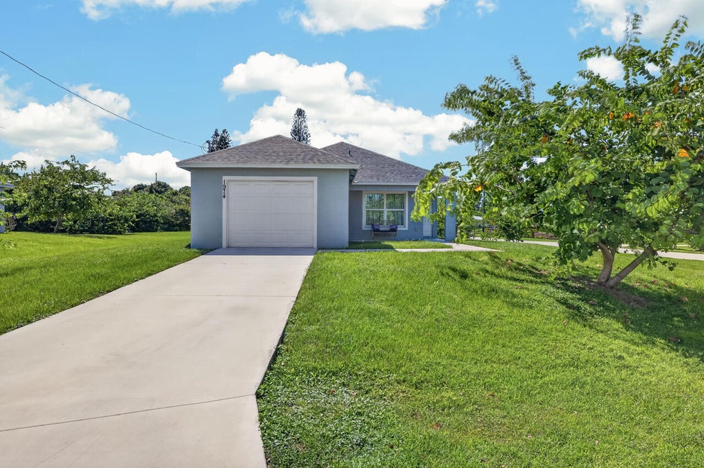 Photo of 1974 SE GENA Road, Port Saint Lucie, FL 34952 (MLS # B26074841)