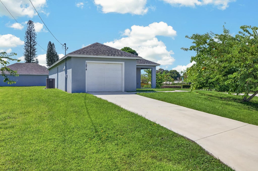 Photo of 1974 SE GENA Road, Port Saint Lucie, FL 34952 (MLS # B26074841)