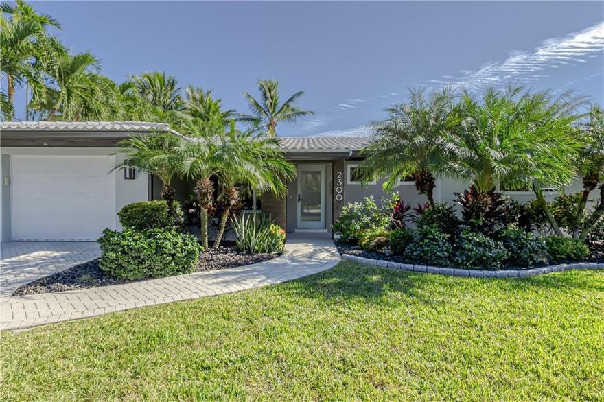 Modern and bright 3 bedroom, 2 bath, waterfront pool home with only 2 fixed bridges to the Intracoastal.  Attractive Travertine pavers around the pool deck with lush landscaping creates a private setting to enjoy your backyard.  Saltwater pool heated by solar panels.  35' dock with 3,500lb boat lift.  Open Kitchen with Quartz counters, engineered hardwood  floors in the main living areas & porcelain flooring in the bedrooms.  All closets have custom built-ins with installed lighting.  Impact windows and doors throughout, including the garage door!  A/C systems new in April 2019, tankless hot water heater.  Furniture is negotiable.  Wonderful NE Wilton Manors waterfront neighborhood --- NE 15 Ter is the closest waterfront street & yet still walkable to Dixie Village and Wilton Drive action.