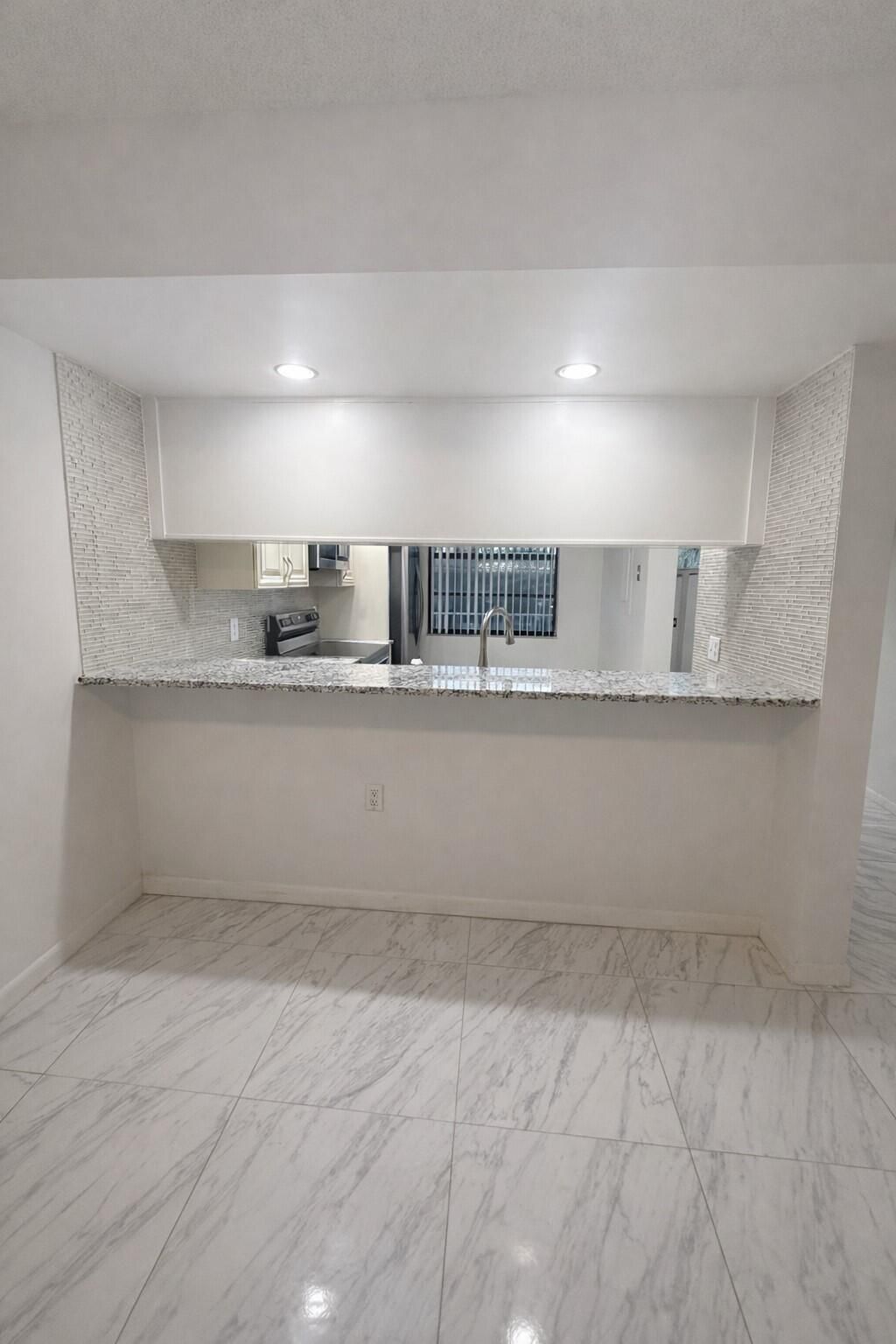 Photo of 3826 Whitehall Drive #305, West Palm Beach, FL 33401 (MLS # R11155454)