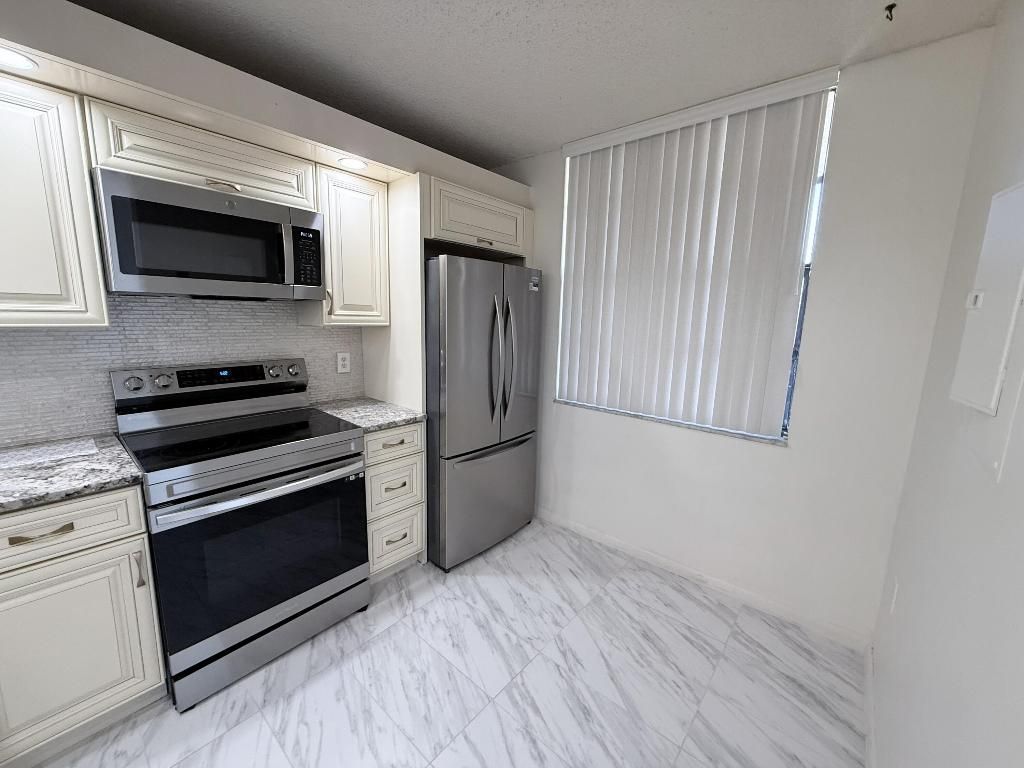 Photo of 3826 Whitehall Drive #305, West Palm Beach, FL 33401 (MLS # R11155454)