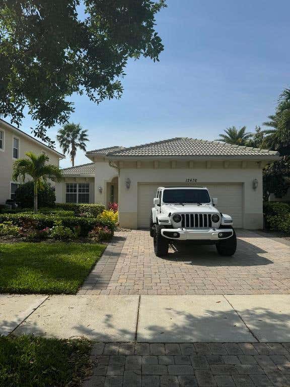 Photo of 12476 Aviles Circle, Palm Beach Gardens, FL 33418 (MLS # R10969150)
