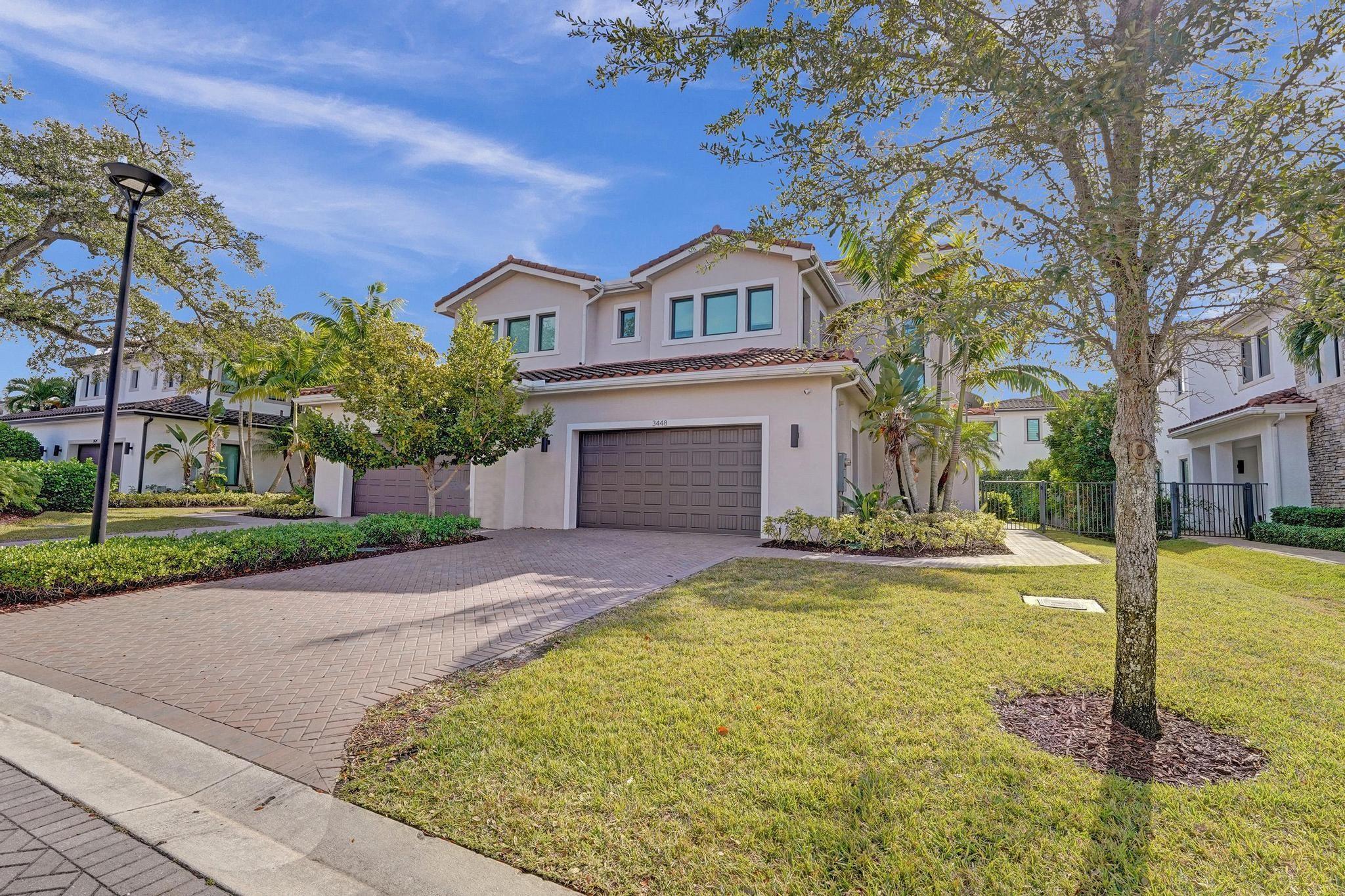 Elegant Spacious and Chic Describes this Wonderful Four Bedroom Four and a Half Bath Coach Home in The Desirable Gated Community the Preserve at Emerald Hills. High End Finishes Include Porcelain Tile, Mia Cucina Kitchen Cabinetry, Quartz Countertops, Pantry with Upgraded Built-ins, A Gorgeous Wet Bar & Wine Cooler, Bosch appliances, Gas Stove, Dryer & Hot Water Heater. Wood Staircase, All Bedrooms Are En-Suite. Designer Upgrades Include Beautiful Light fixtures, Wallpaper, Built-in in Family Room. Garage Features A/C & Storage Closets an EV Charger & the Home Is Fully Impact Glass. Step Outside to The Backyard & Enjoy the Summer Kitchen, Gas BBQ Expanded Patio & Gazebo. The Community Has 24 Guard Gate, Heated Pool, Gym & Clubhouse. Located Close to Houses of Worship, Fll Airport, I95.