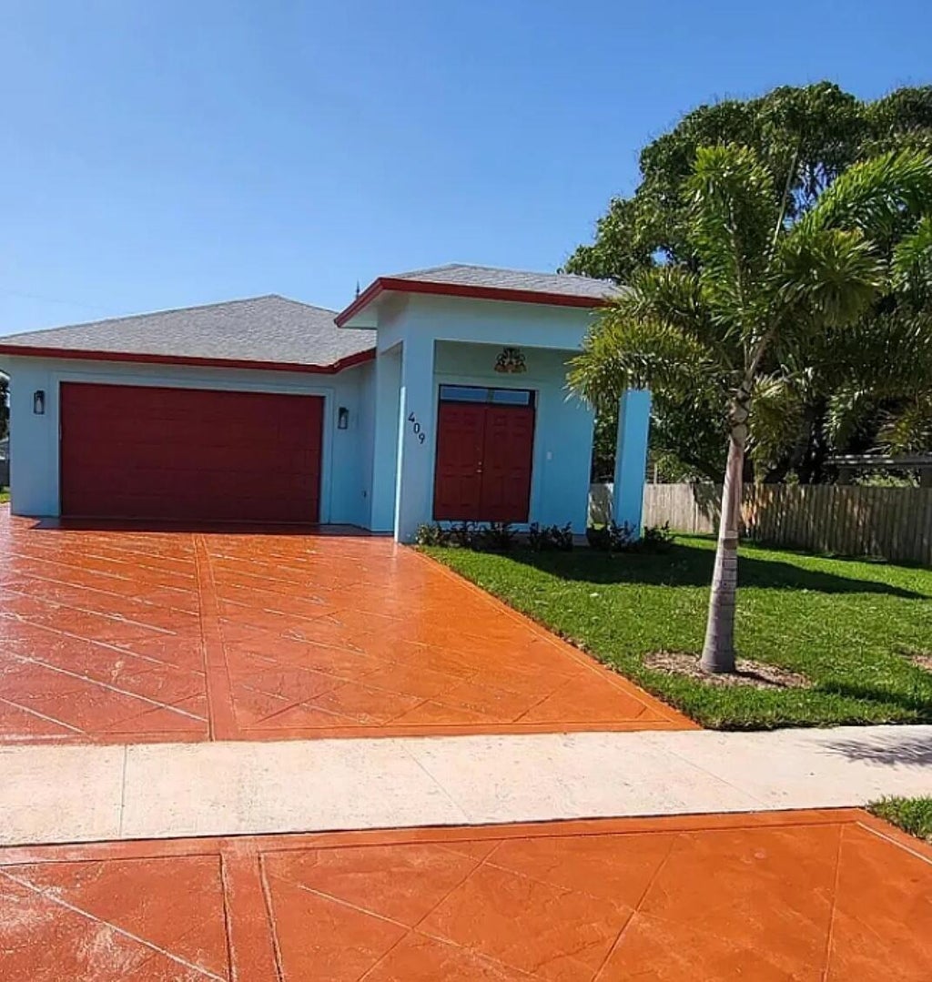 Photo of 409 BROWARD Avenue, Greenacres, FL 33463 (MLS # B26071765)