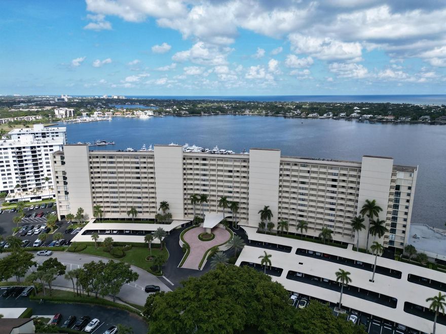 Welcome to this luxurious condominium, where resort-style living meets a million-dollar view! Rest easy, as all milestone inspections and repairs are complete, backed by strong reserves. This spacious, impeccably maintained, beautifully furnished 1BR/1.5BA unit offers turnkey living at its finest. The gorgeous, updated kitchen features quartz counters, SS appliances, and soft-close cabinetry. Renovated baths, tile flooring, plantation shutters, and a 2-year-old HVAC add comfort and style. A magnificent 28-foot private patio, secured with accordion shutters, provides a stunning, panoramic backdrop of the sparkling Marina, the Intracoastal Waterway, and Lost Tree Village. Extra storage space is conveniently located just steps from your front door. This is coastal living at its best!