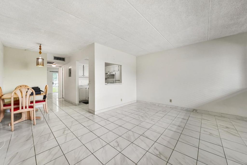 Photo of 400 Village Green Circle W #205, Palm Springs, FL 33461 (MLS # R11132371)