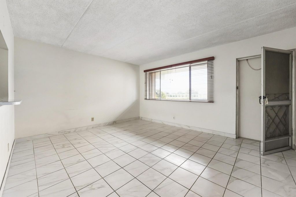 Photo of 400 Village Green Circle W #205, Palm Springs, FL 33461 (MLS # R11132371)