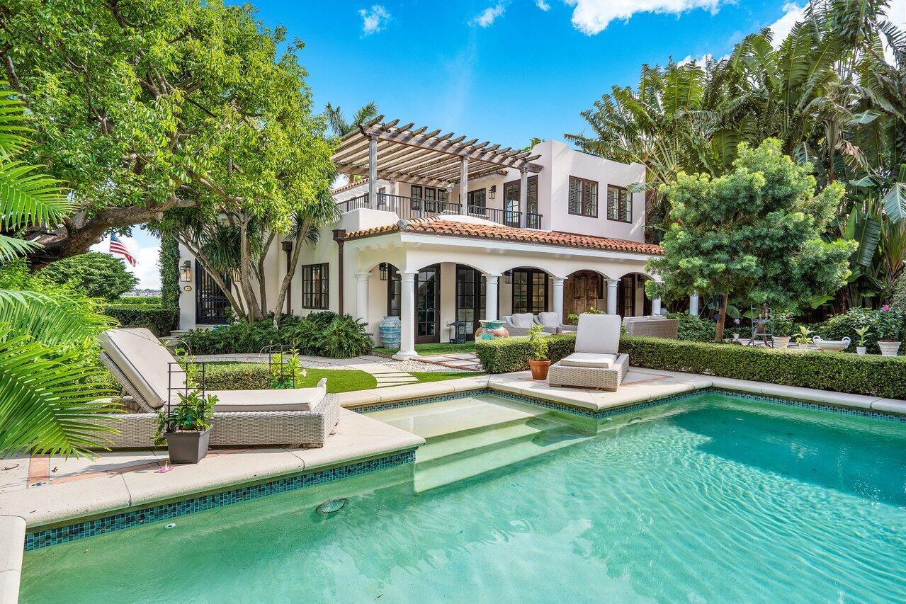 Beautifully renovated with exquisite details, enjoy this 1920's Spanish Mission style home in El Cid. A rare find with panoramic intracoastal views, the intrigue begins behind the iron gates with the most enchanting tropical gardens, outdoor terraces, and pool area, perfect for the South Florida lifestyle. A bright, airy home, it has quality finishes along with a large primary suite, separate guest apartment above a 2 car garage, full house generator, and hurricane impact glass. This special home is a must see and buying opportunity!